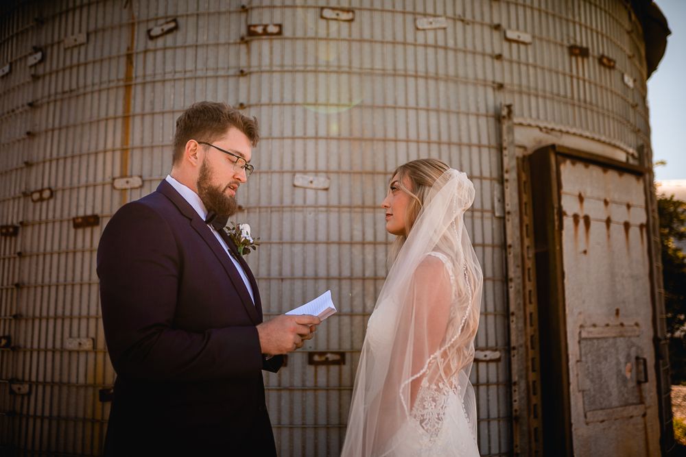 Bride and groom sharing intimate vows in a private moment, captured by Morgan Lea Photography Hannibal Missouri