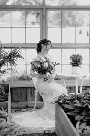 a woman, sitting down in a greenhouse in bremen, georgia