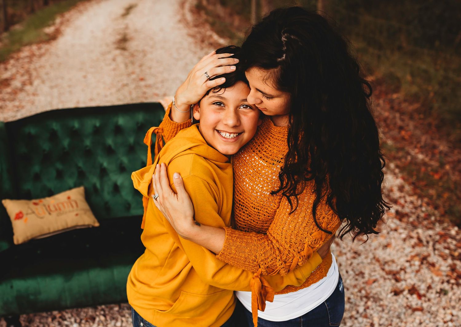 Mama holding her son and him laying his head on her chest in Angleton, Tx photography studio