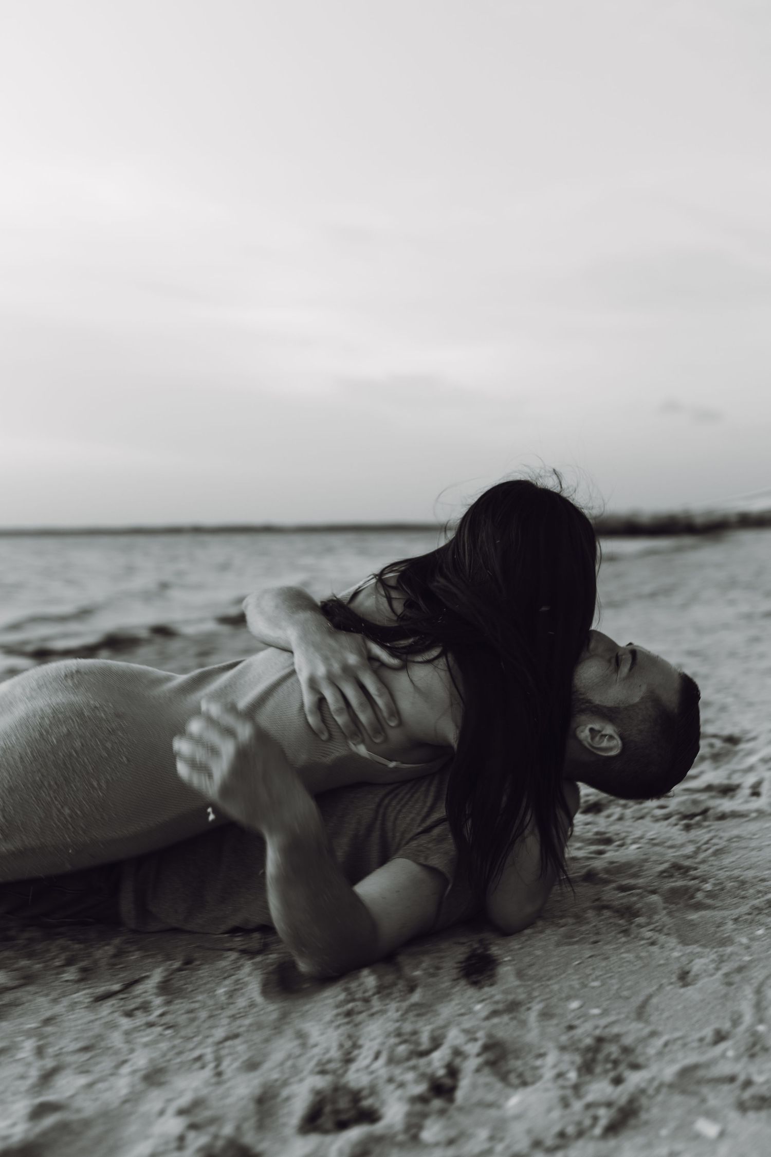 Florida engagement photo on the beach black and white couple in the sand