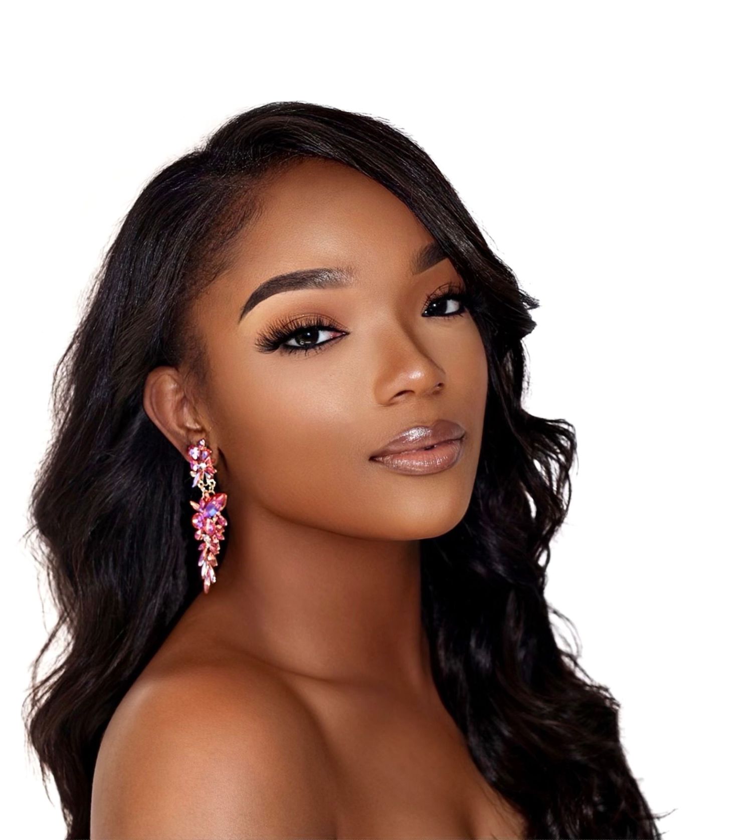 Beauty portrait with pink chandelier earrings and flowing dark hair.