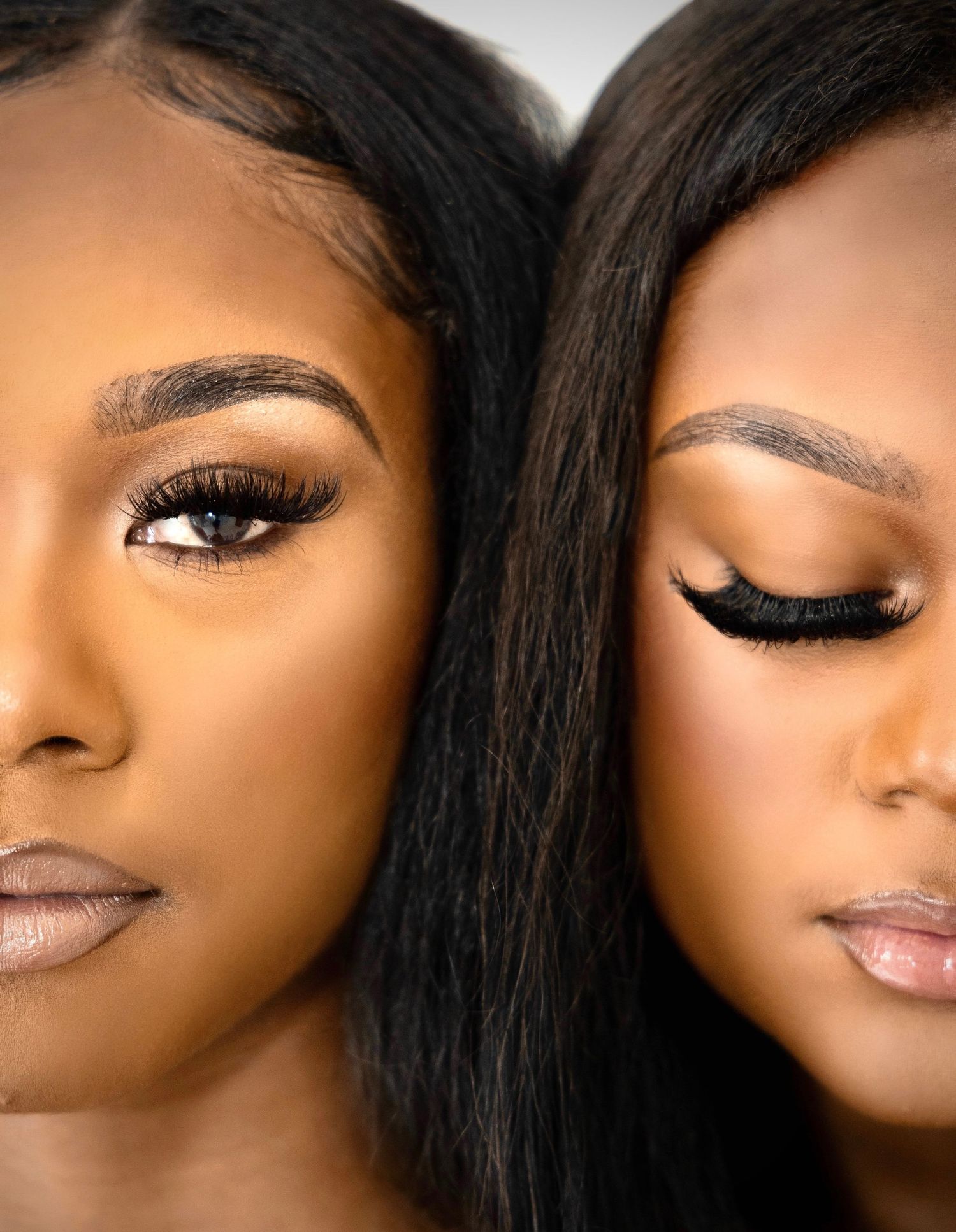 Close-up beauty portrait showcasing dramatic eye makeup and flawless skin.