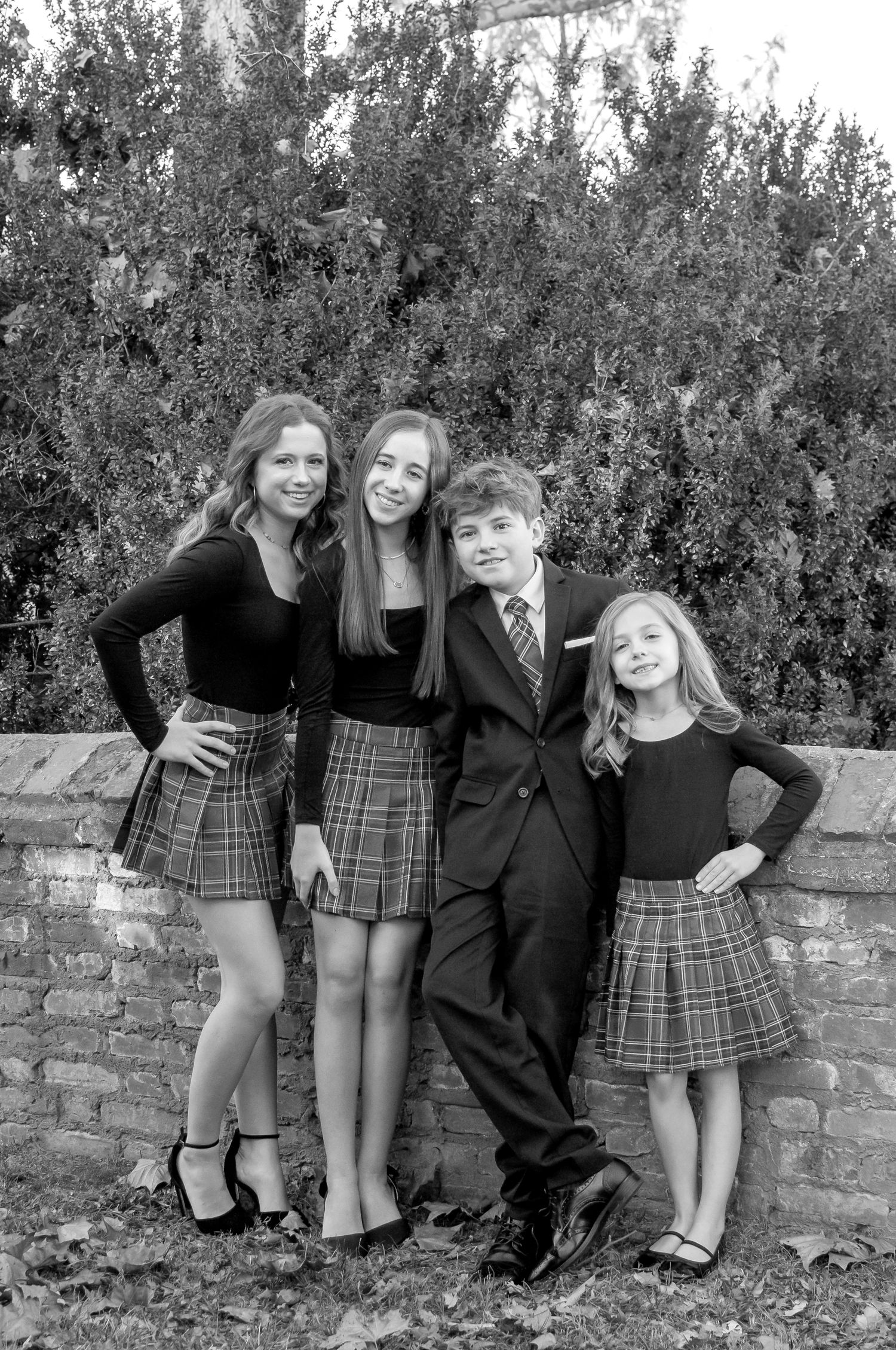 Black and white image of 4 siblings