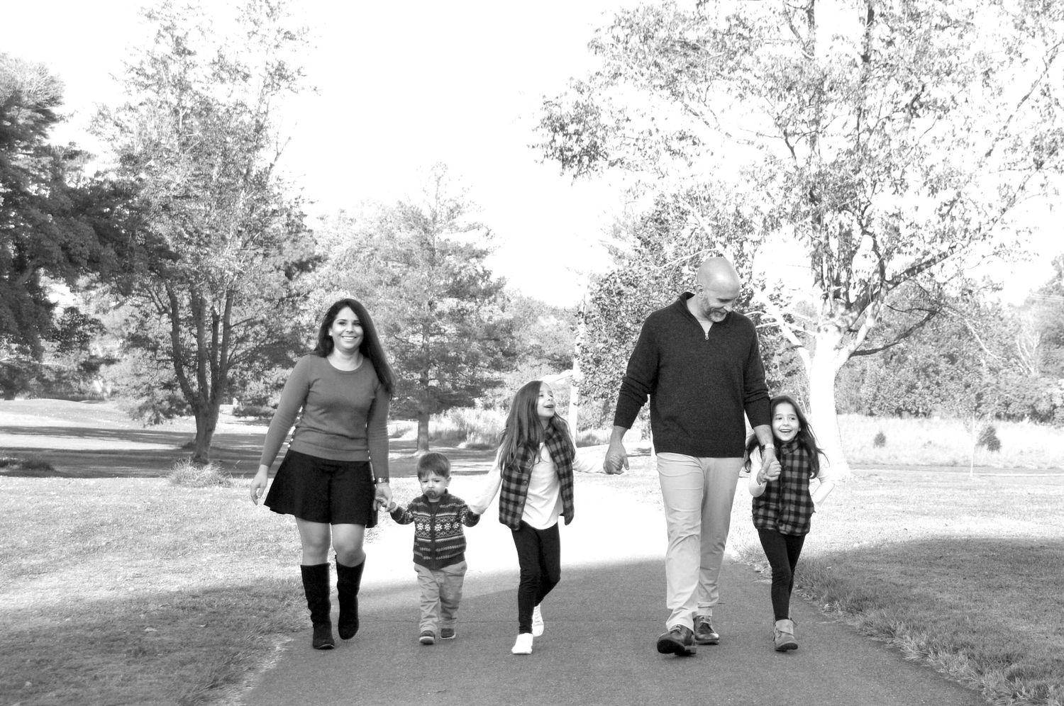 black and white photo of family walking at Algonkian Park