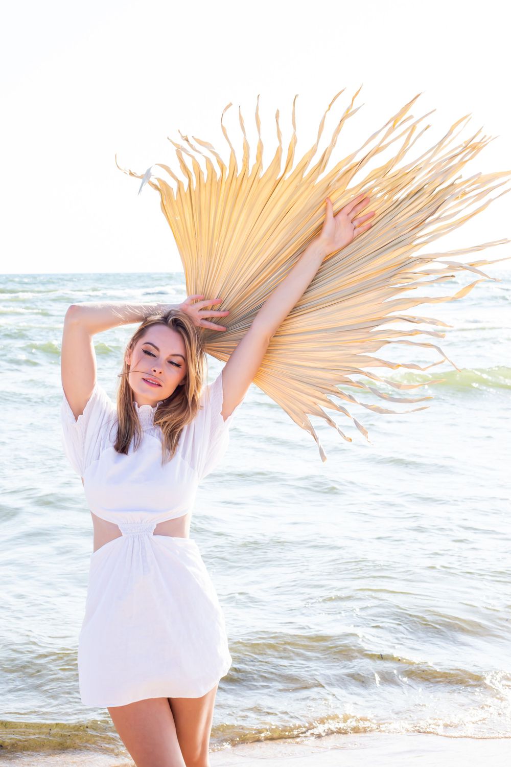 Lady in a white dress by Lake Michigan