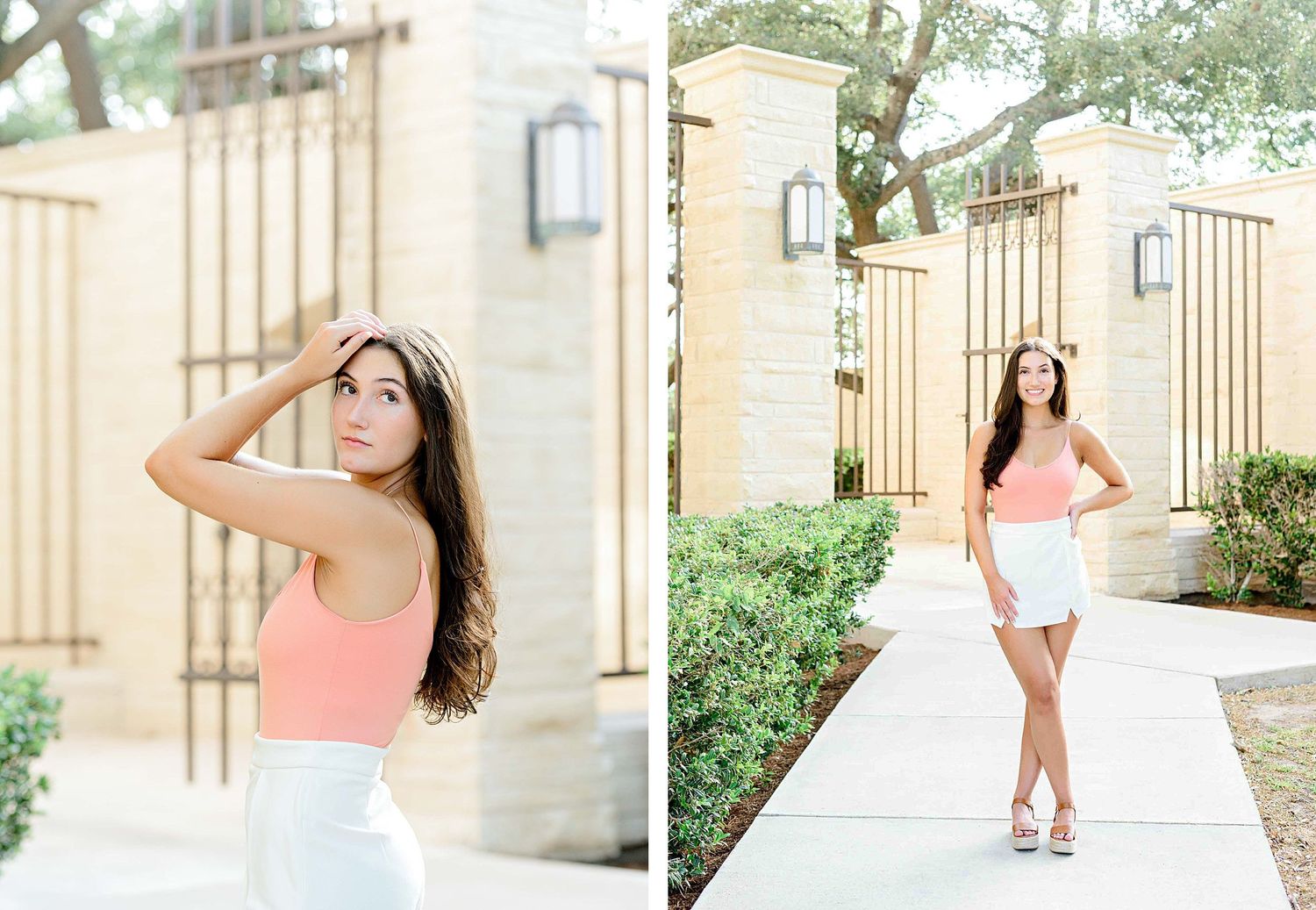 Woman in peach tank top and white skirt poses outdoors by stone wall and landscaping on sunny day.