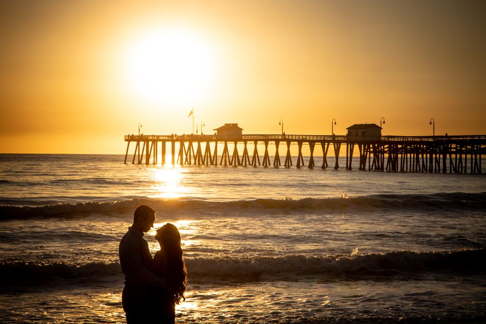 Silhouette of a couple during sunset by the san clemente pier