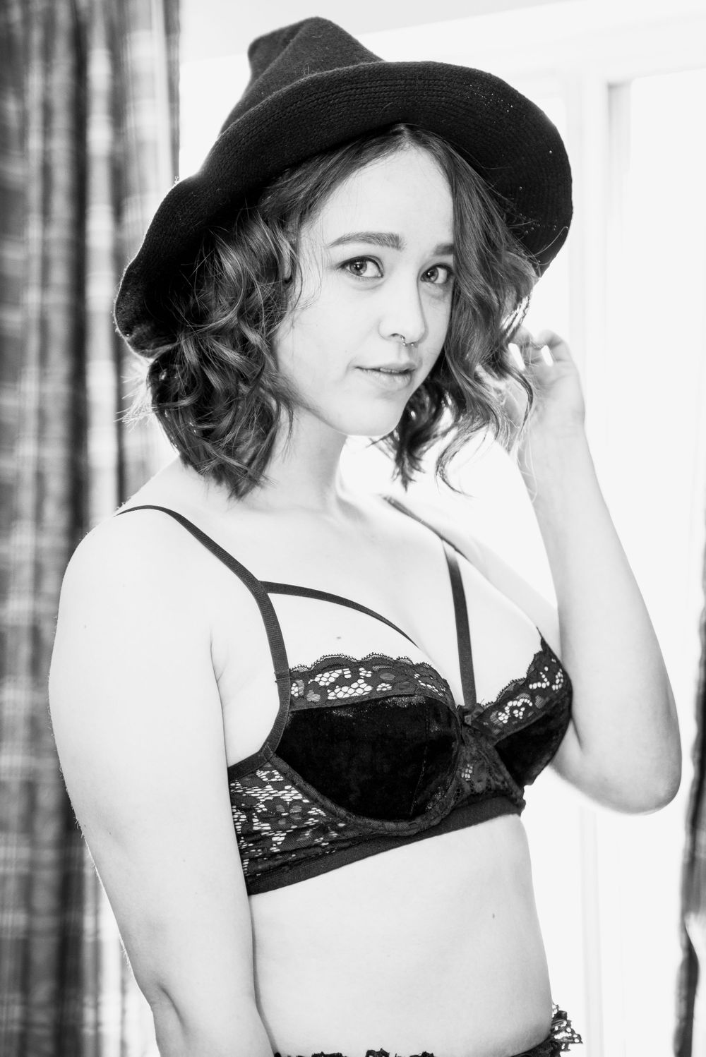 Black and white boudoir photo of a woman in lingerie, captured by Chris Cornish Photography.