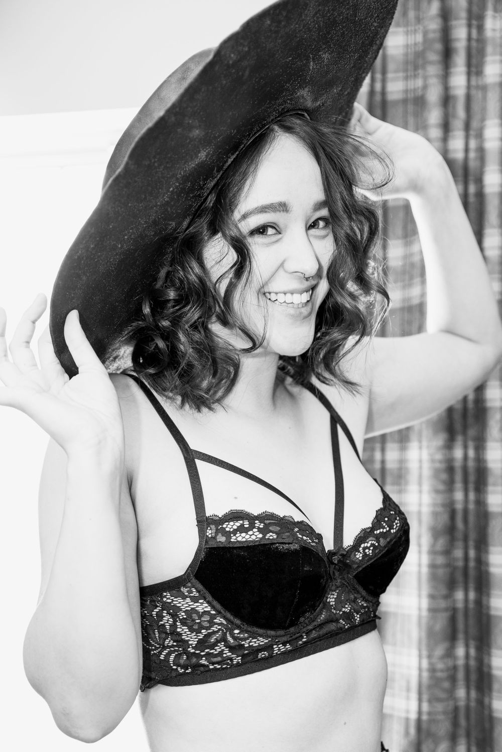 Black and white boudoir photo of a woman in lingerie, captured by Chris Cornish Photography.