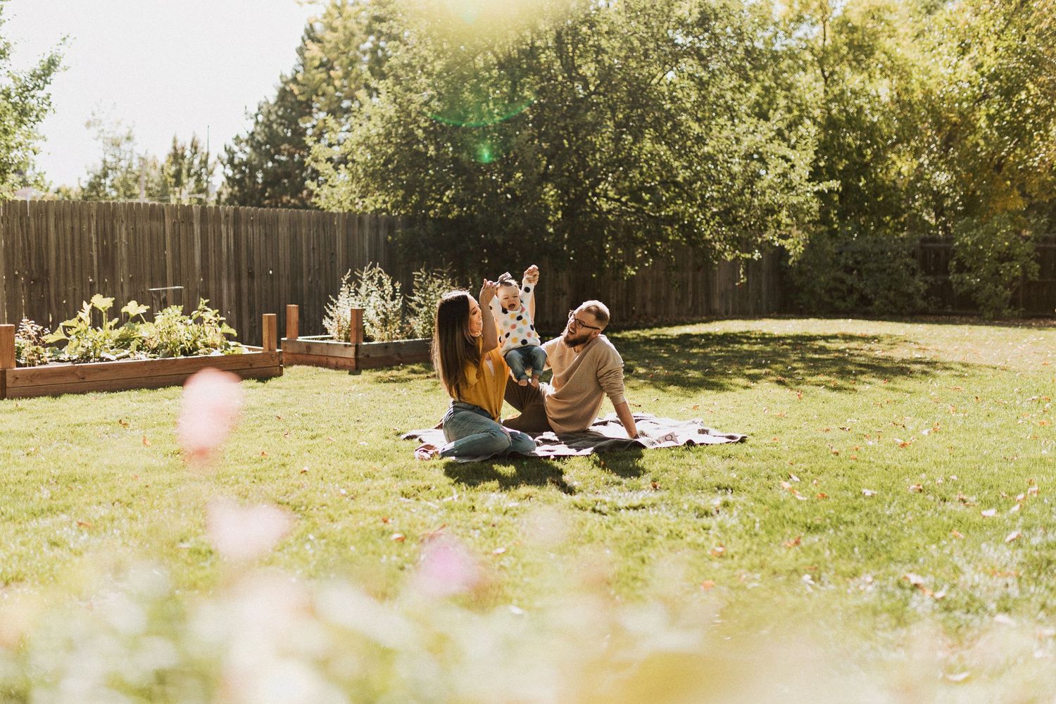 Family sitting in backyard