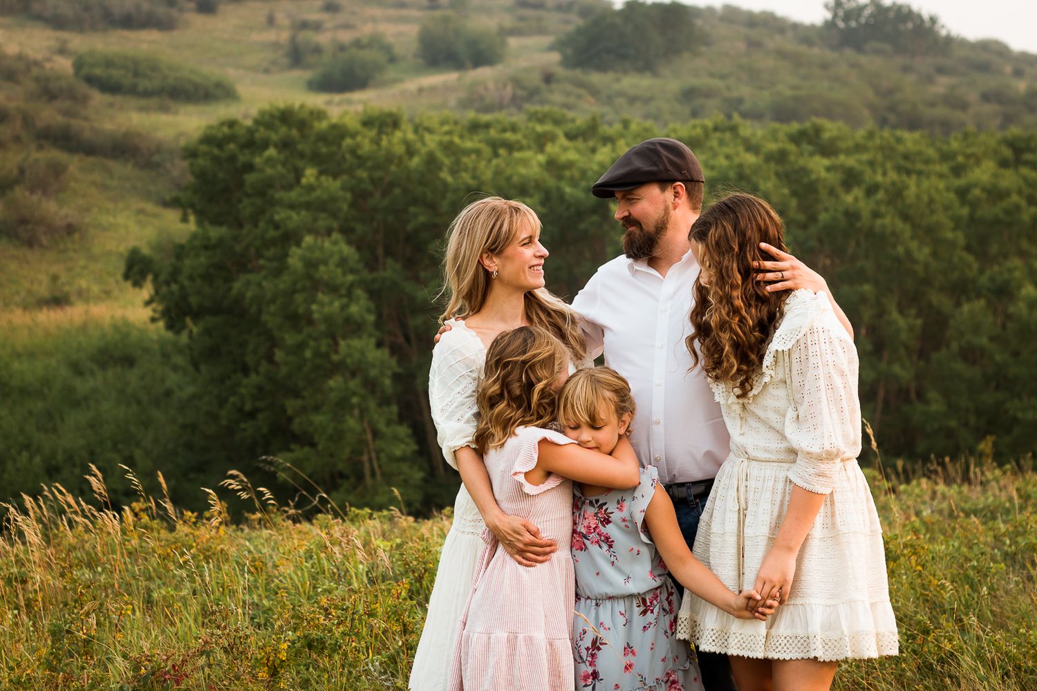 Beautiful family photography at Nose Hill Park in summer by Love & Sunshine Photography