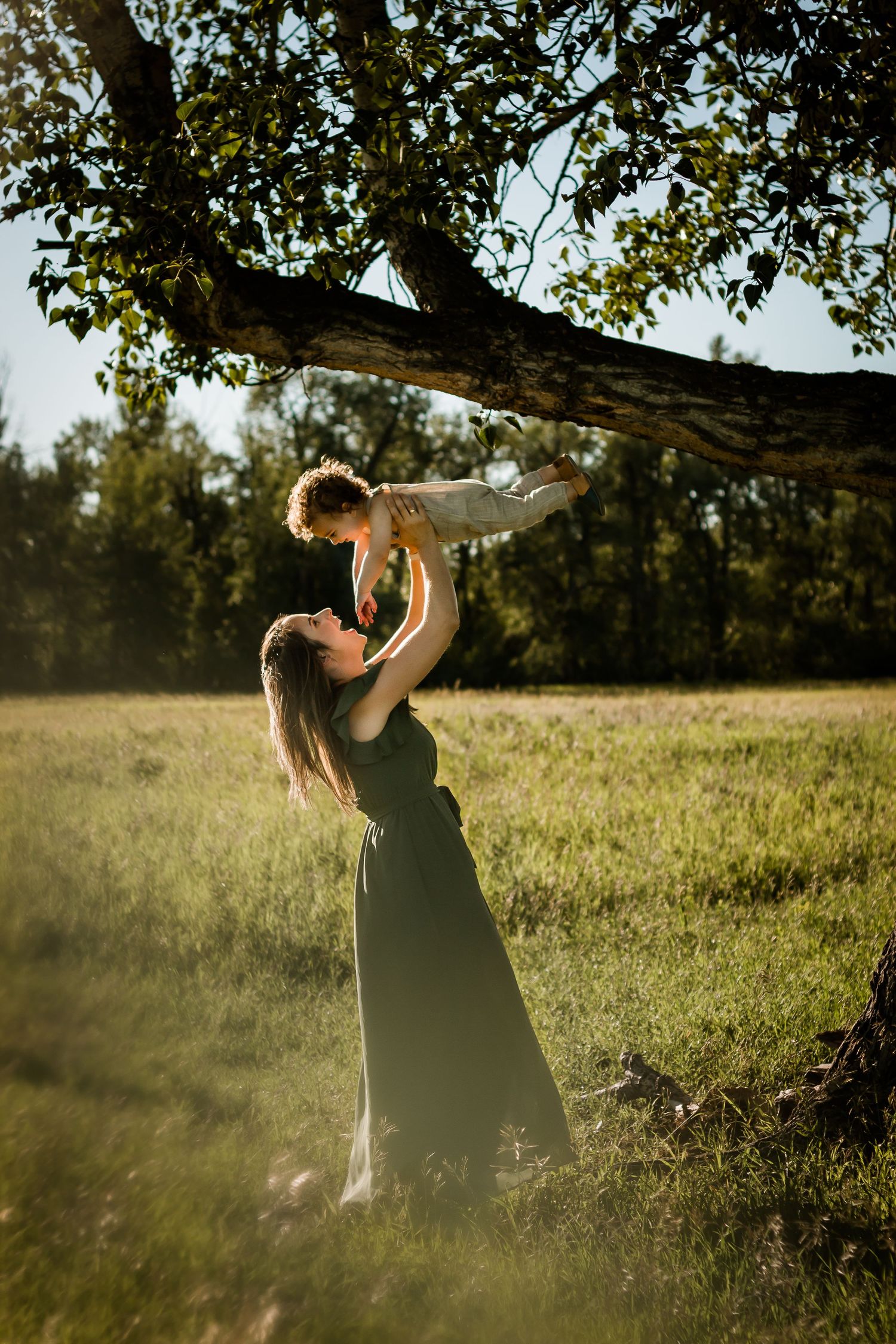 Beautiful motherhood moment: Lifestyle family photography in Calgary Alberta by Love & Sunshine Photography.