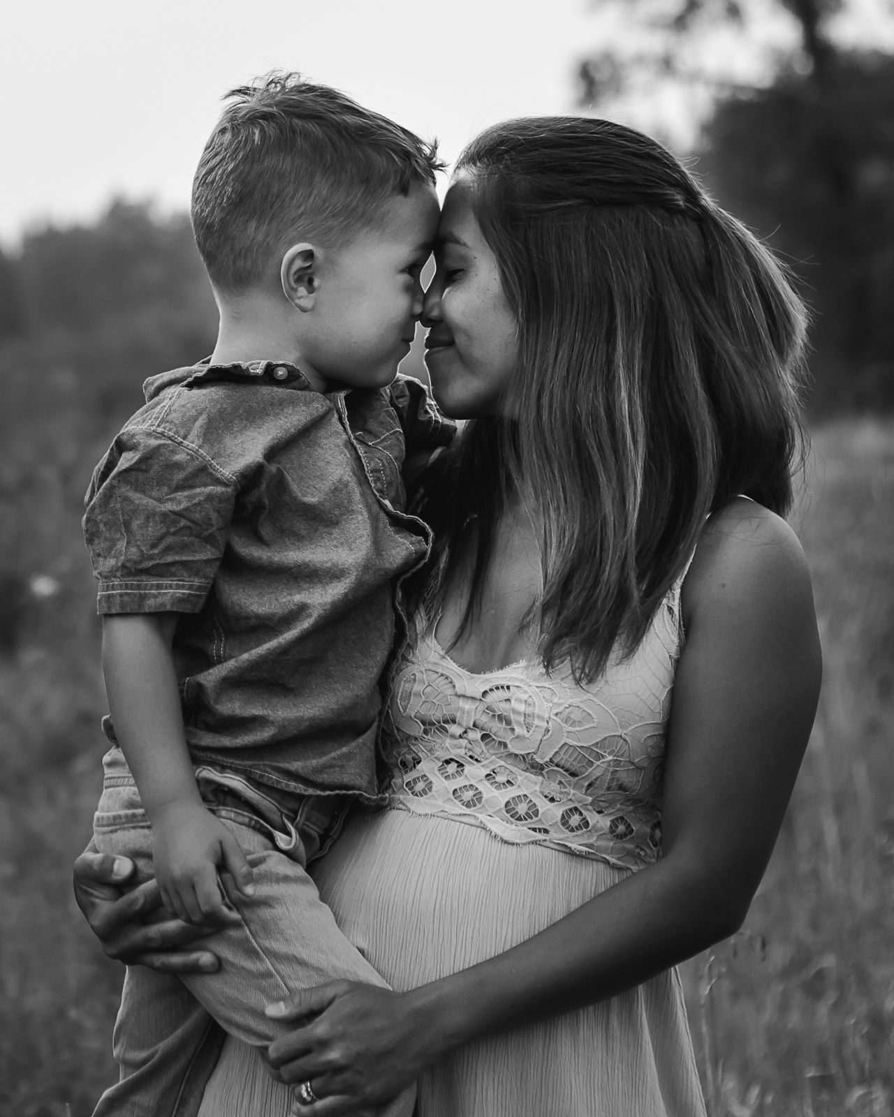Black and white portrait of mother & son moment during family photos in Calgary AB by Love & Sunshine Photography.
