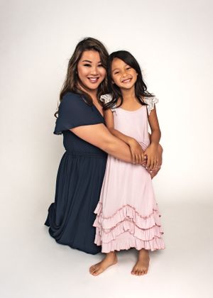studio portrait of a mom and child