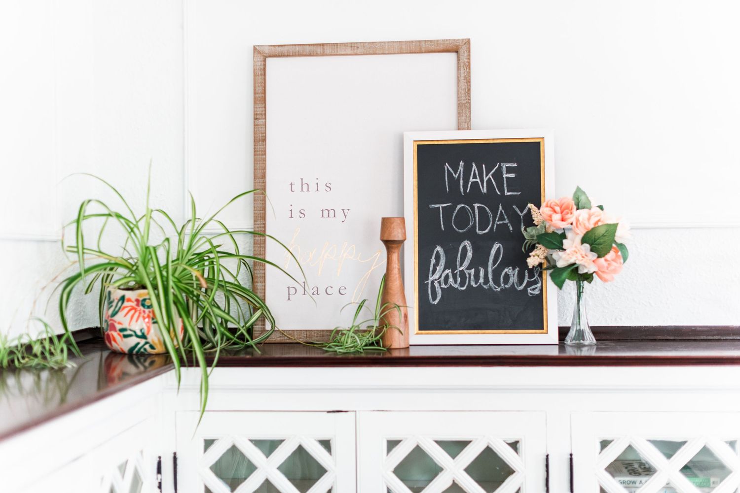 Bloomington, Illinois mantel styled with “Make Today Fabulous” framed photo, potted plants, and flowers by Julie Loy Photography
