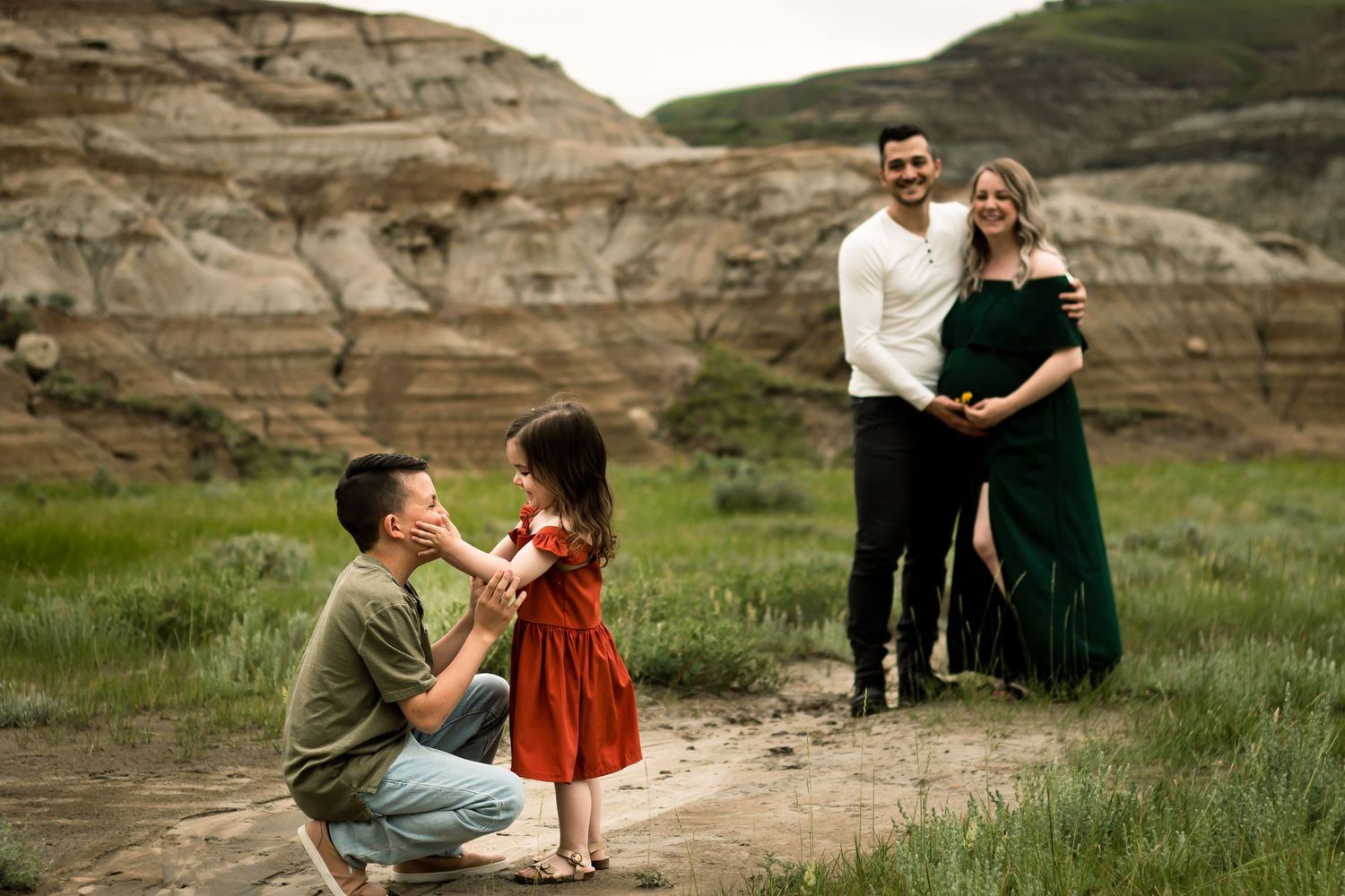 Beautiful authentic family maternity photos in Drumheller Alberta during summer by Calgary family photographer.