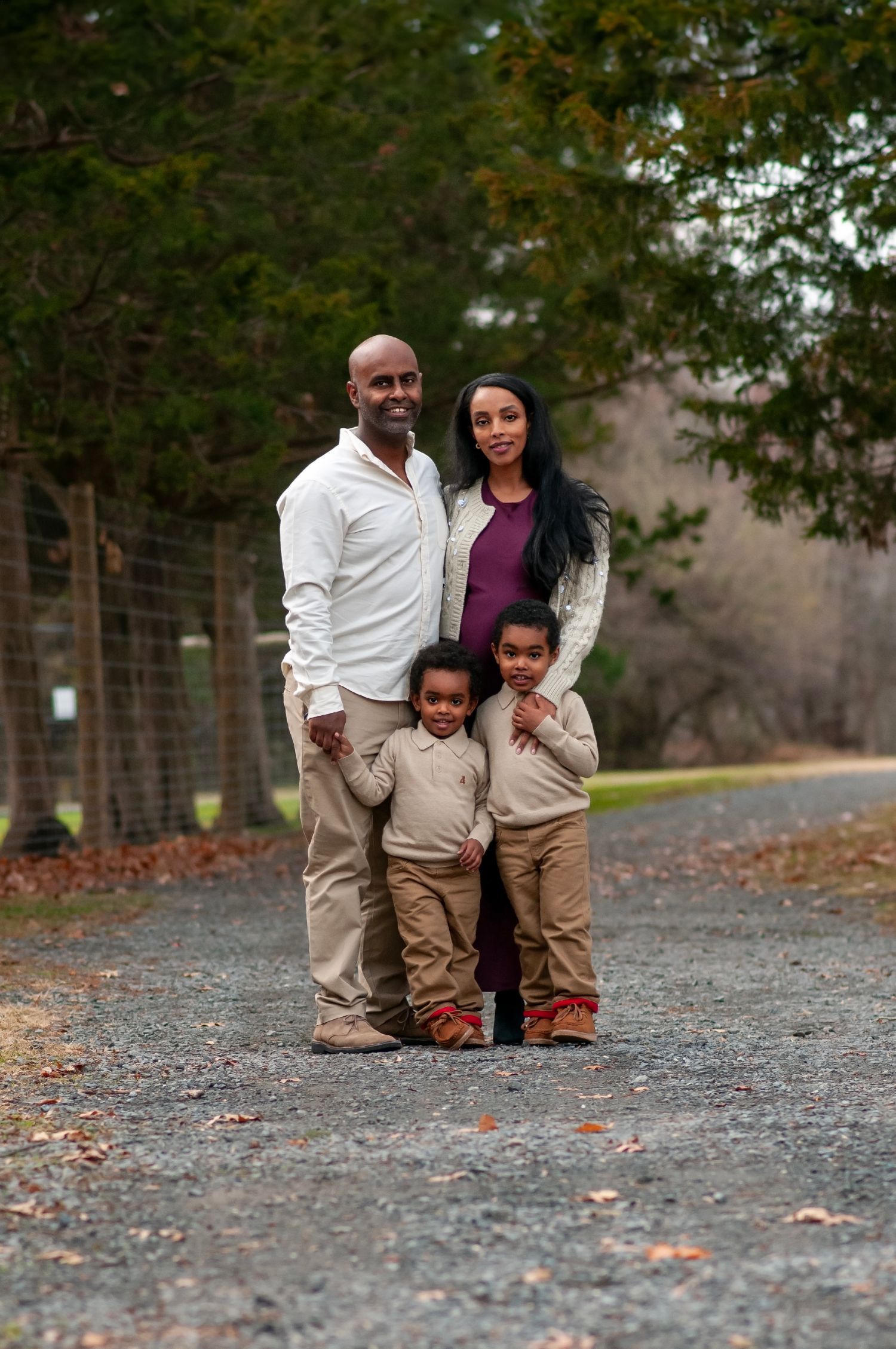 Family standing at Claude Moore Park on gravel path