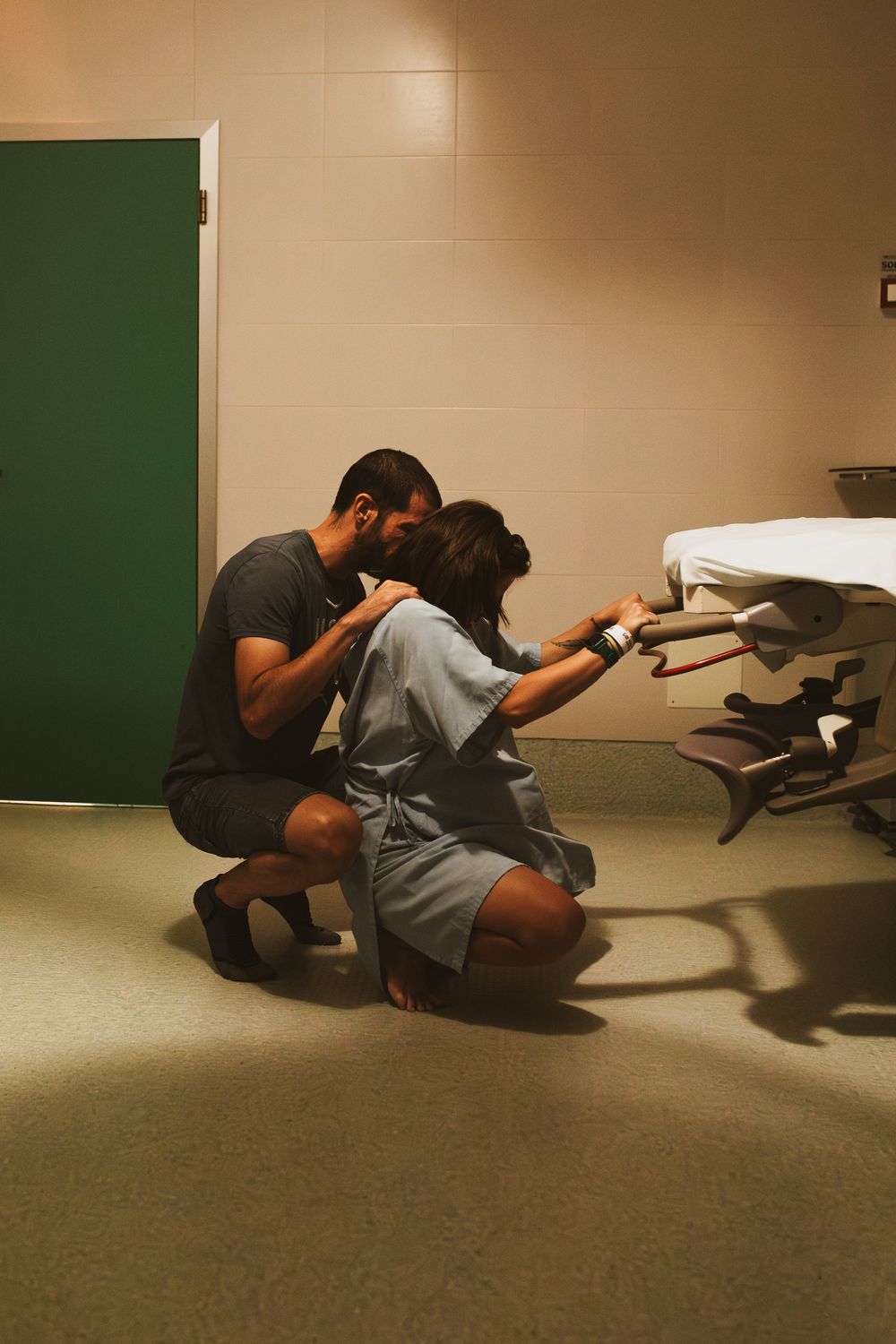 Sequential photos of a person in dark clothing crouching near a green wall in a clinical setting.
