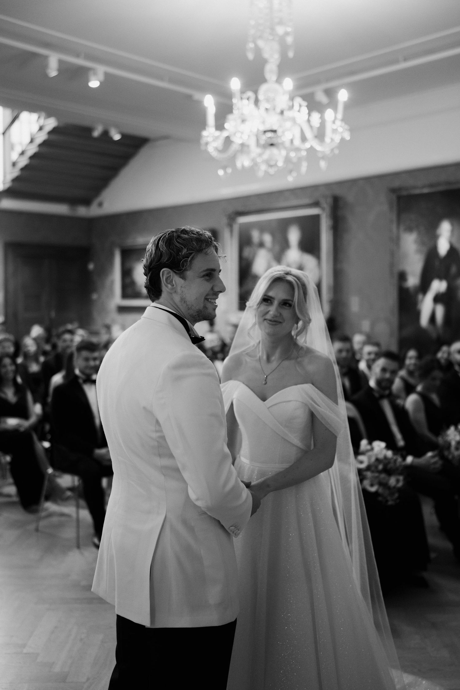 bride looking at groom at the alter in the European art gallery at the ashmolean museum