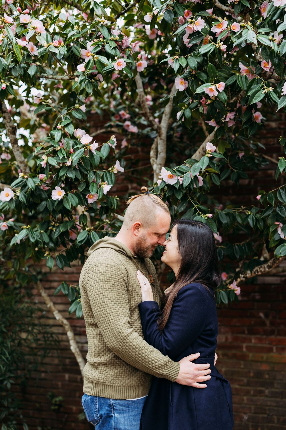 Romantic engagement pictures in flowering trees