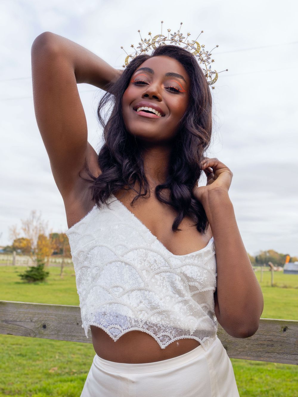 Faz a beautiful black model is wearing a white two piece by Lucy Can't Dance at the canary  Shed in Essex