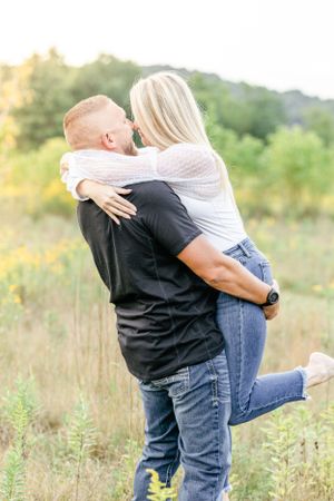 Pittsburgh engagement photographer in field at sunset