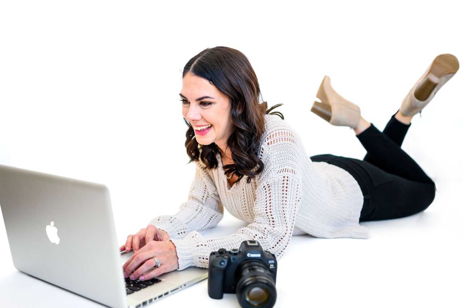 Jessie Peloso Photographer in Raleigh, NC works on her laptop in this styled shoot.