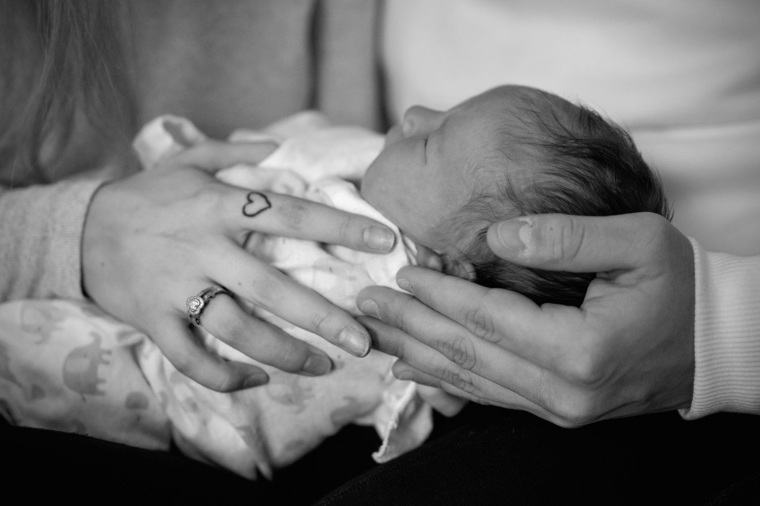 baby hands ring newborn photo black white