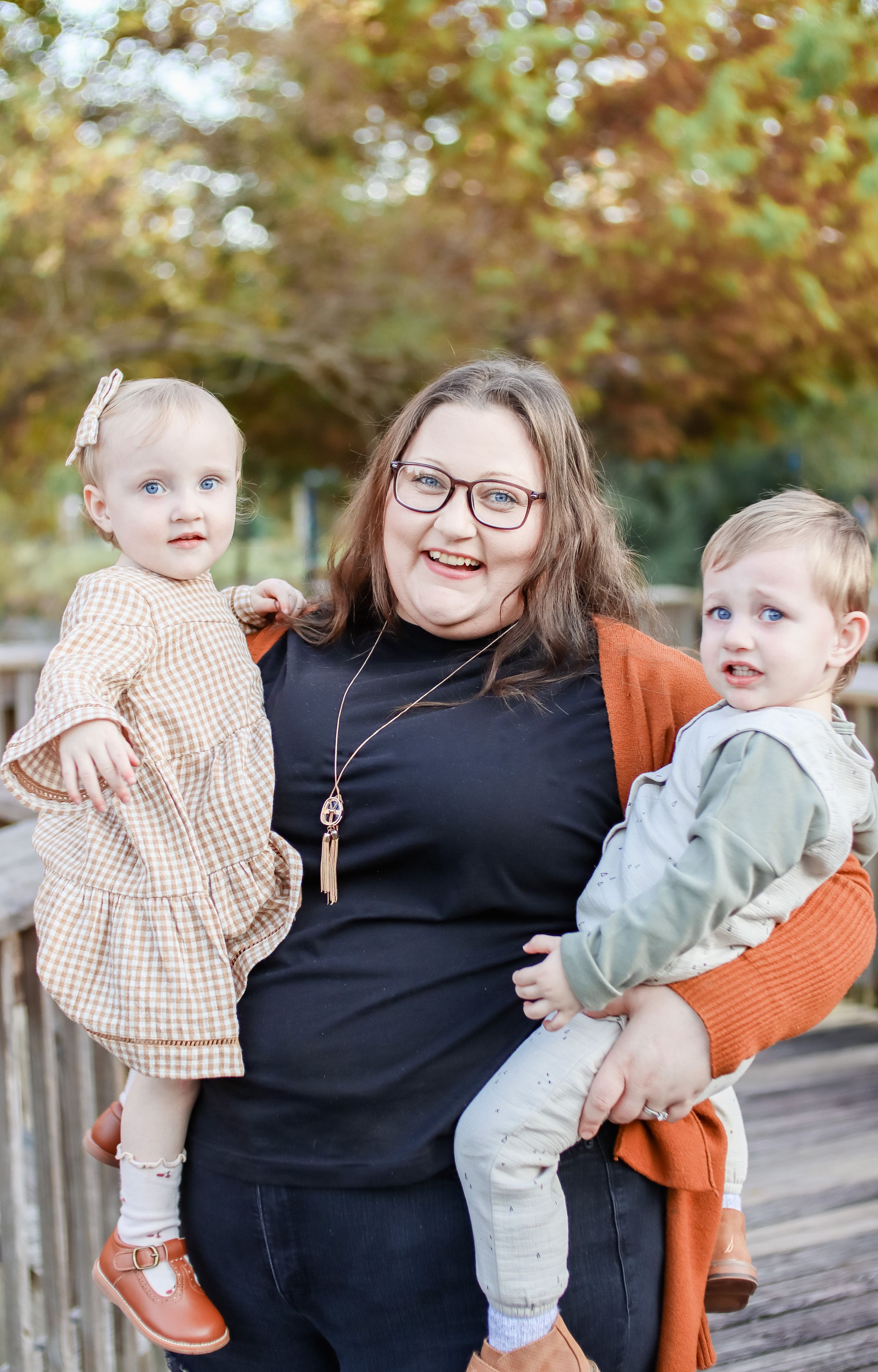 Casual outdoor family portraits showing warm embraces and smiles on an autumn day.