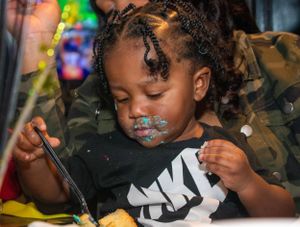 Black Kid Eating Cake