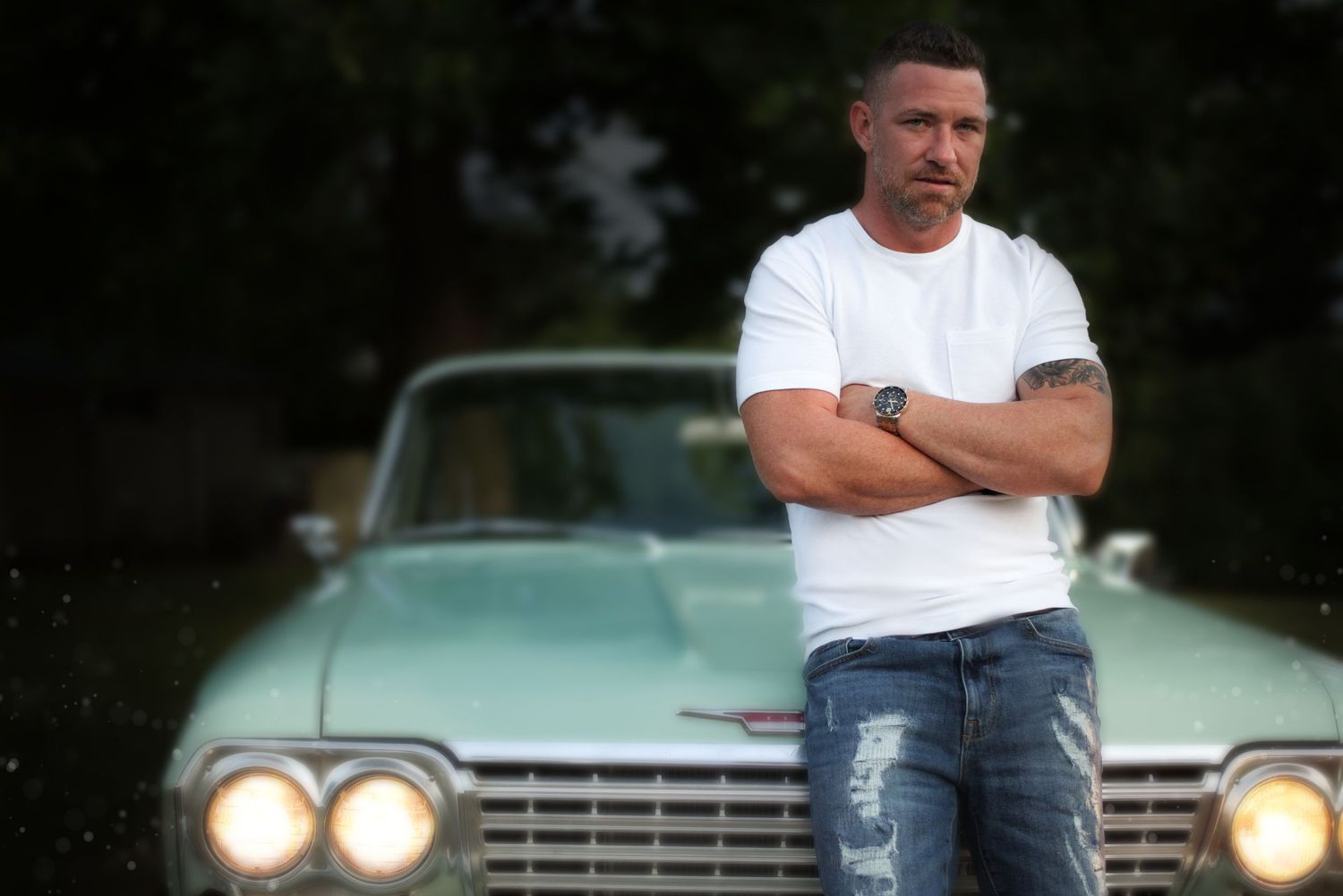 Portrait of man on classic car.