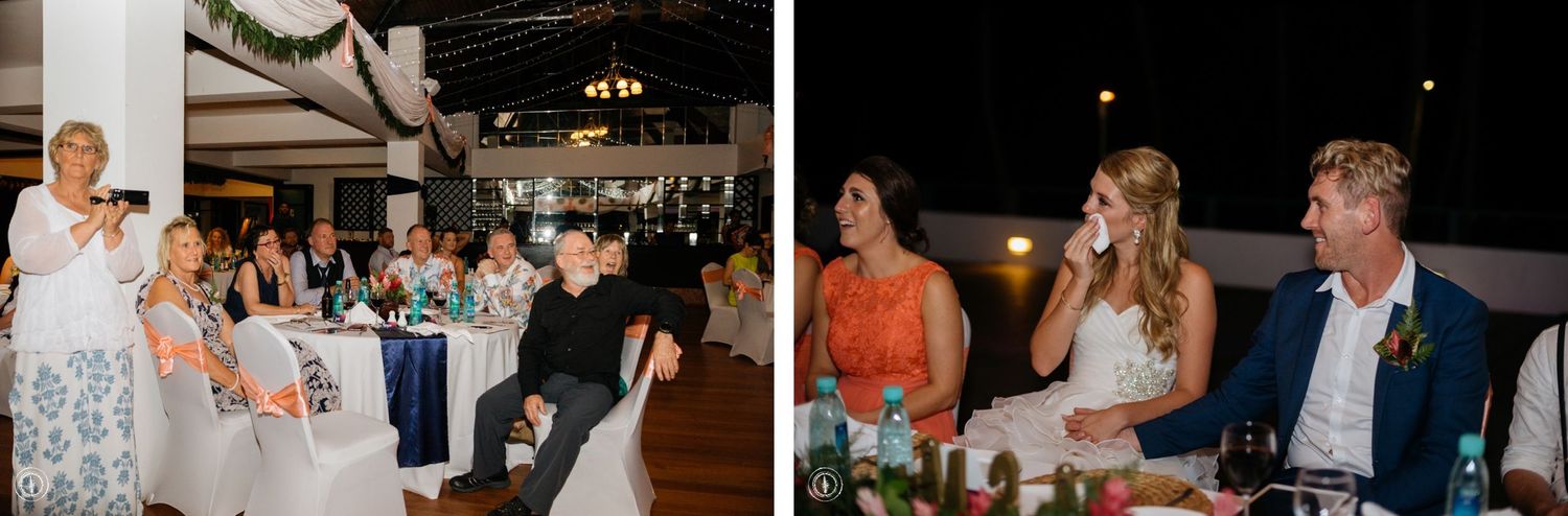 A candid reception dinner scene showing multiple tables of guests during celebrations.