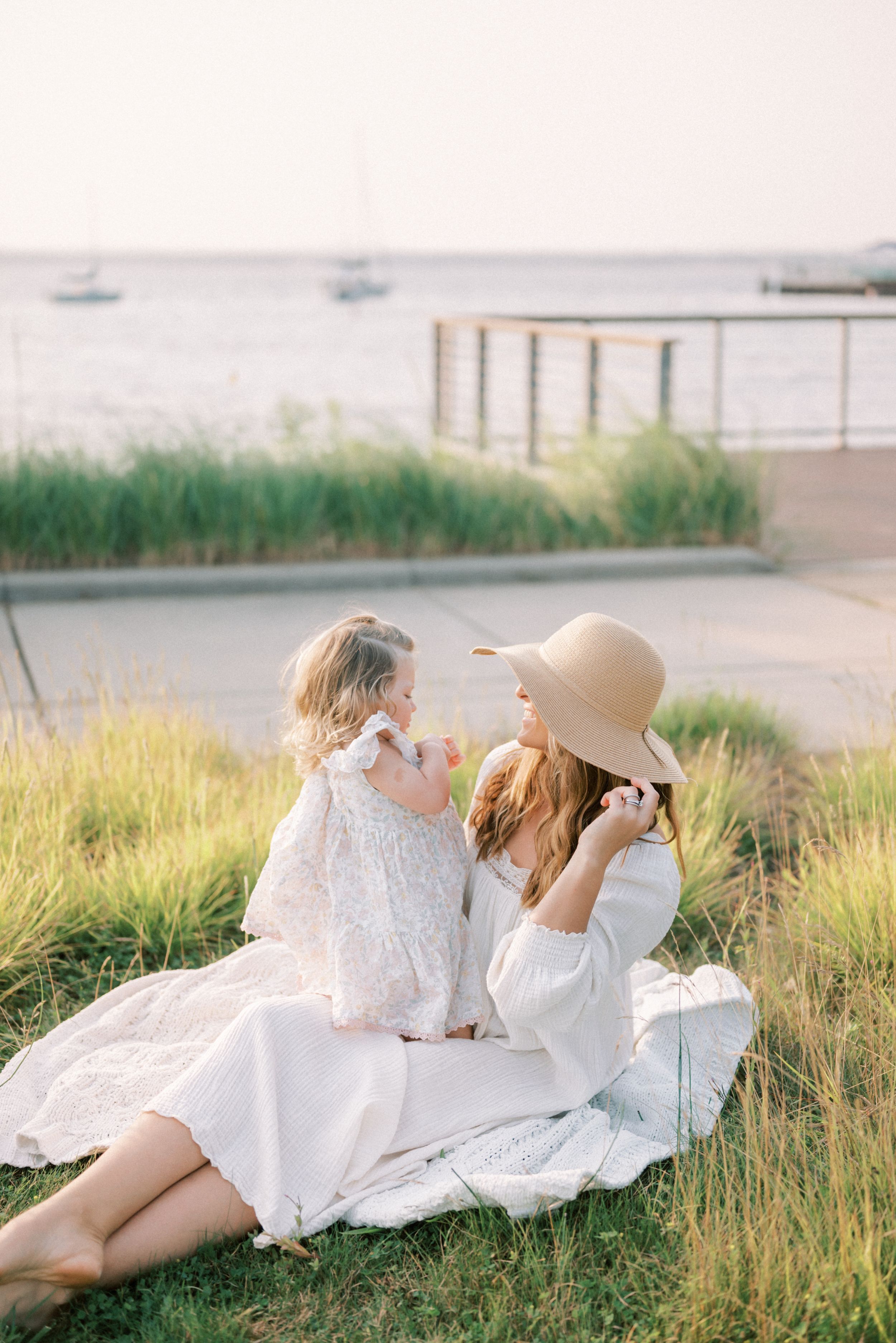 Mother sitting with her daughter outside of a Traverse City Marina