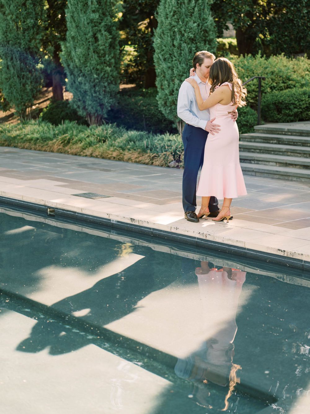engagement session of a couple kissing at the Dallas Arboretum & Botanical Gardens