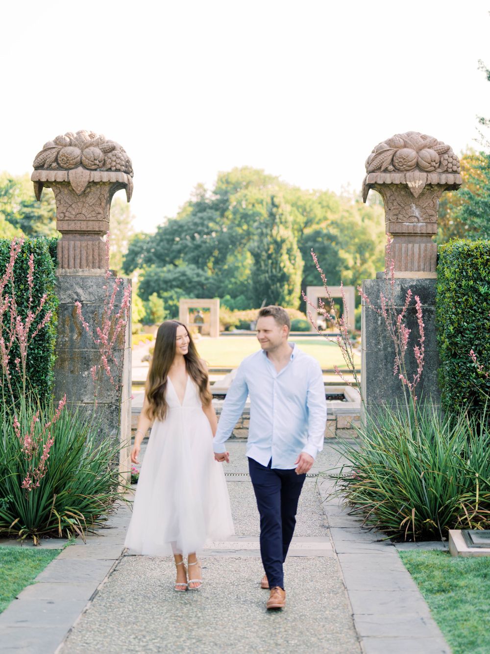 Engagement Session - Couple walking together at Dallas Arboretum
