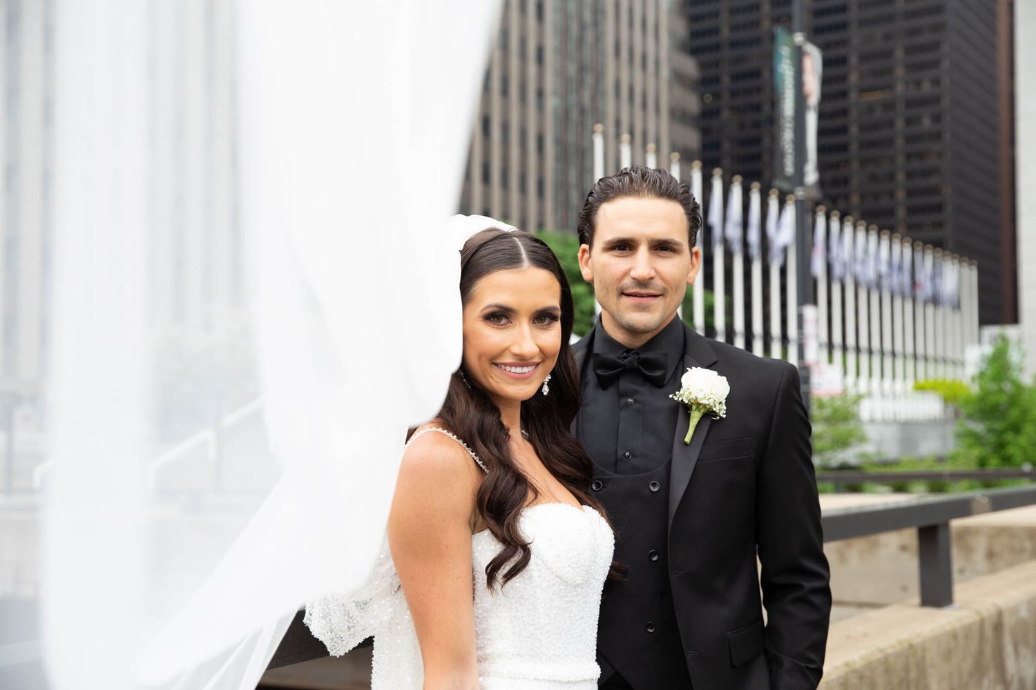 A bride and groom share an intimate moment against an urban Chicago backdrop.