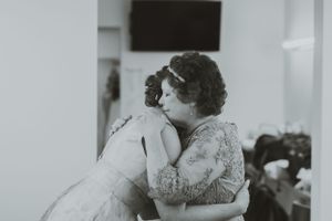 Black and white emotional moment showing an intimate embrace.
