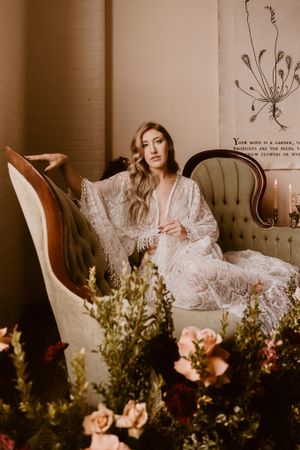 Romantic boudoir scene with lace robe, vintage furniture and fresh floral arrangements in the Hudson Valley,NY.