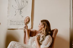 Artistic portrait with hand mirror reflecting soft natural light in the Hudson Valley,NY.