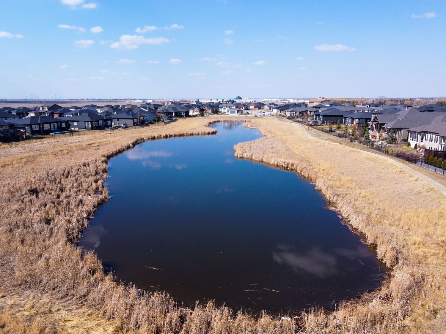 Listing Lens Real Estate Media. Ultimate Package. Drone. Aerial photo of pond.