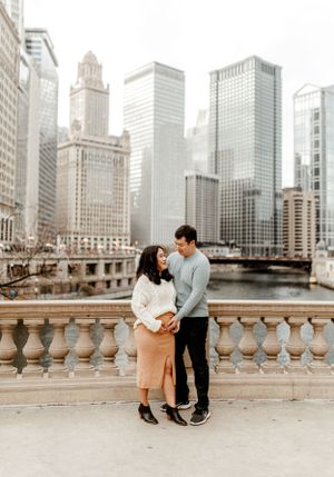 A downtown Chicago engagement photo with the river and classic architecture creating a romantic setting.