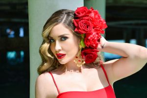 Glamorous vintage-inspired pool photoshoot with red roses and swimwear.