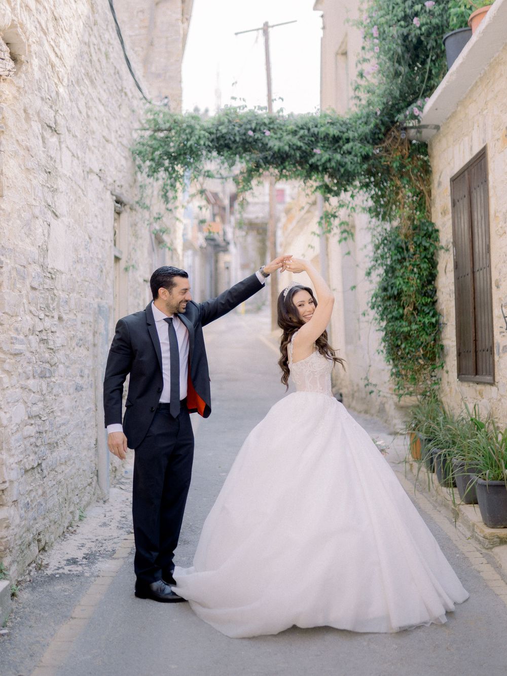 Destination wedding in Cyprus, Lefkara village. Beautiful couple dancing in the old streets