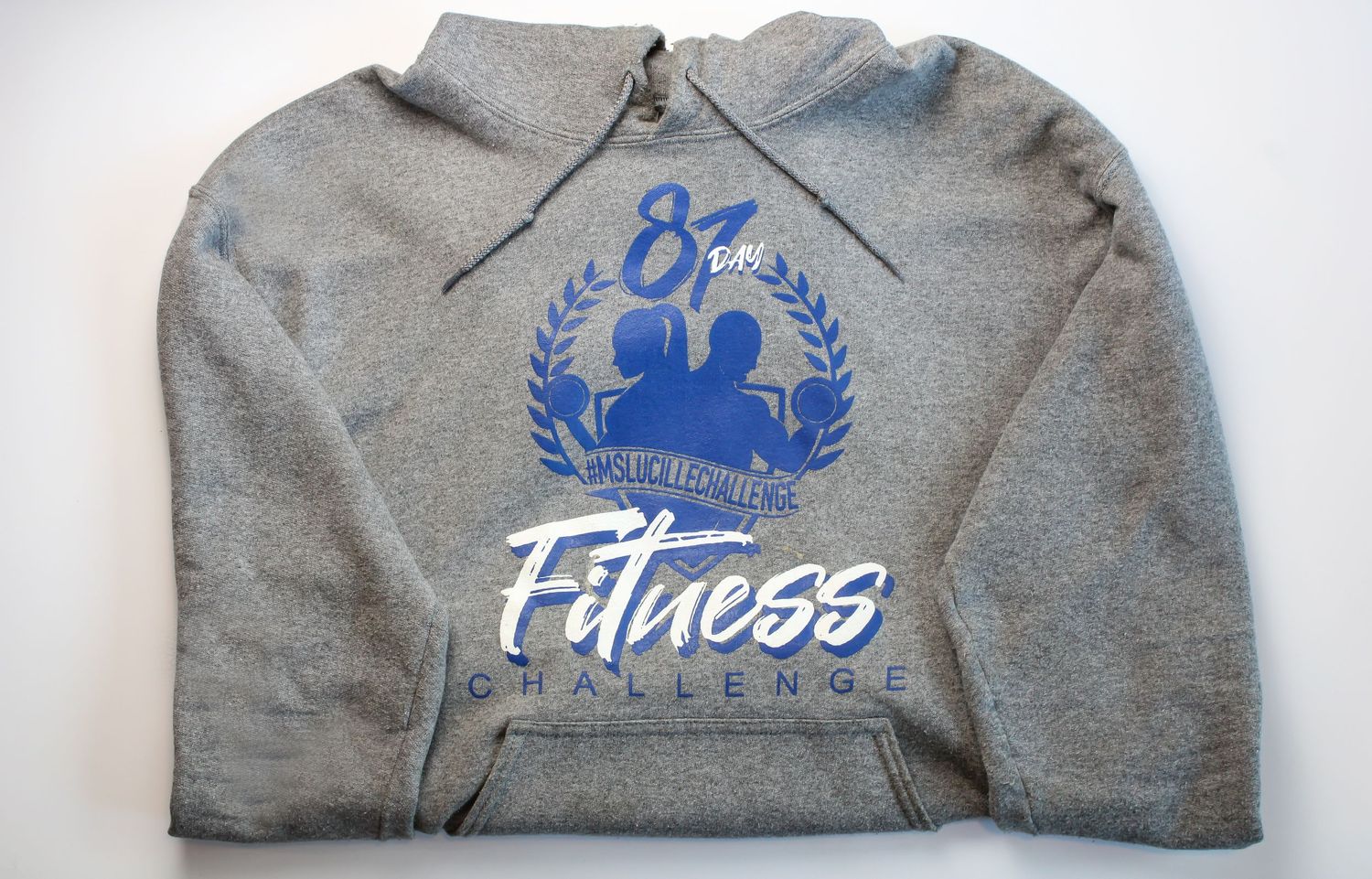 A gray fitness-themed sweatshirt with blue lettering and logo design.