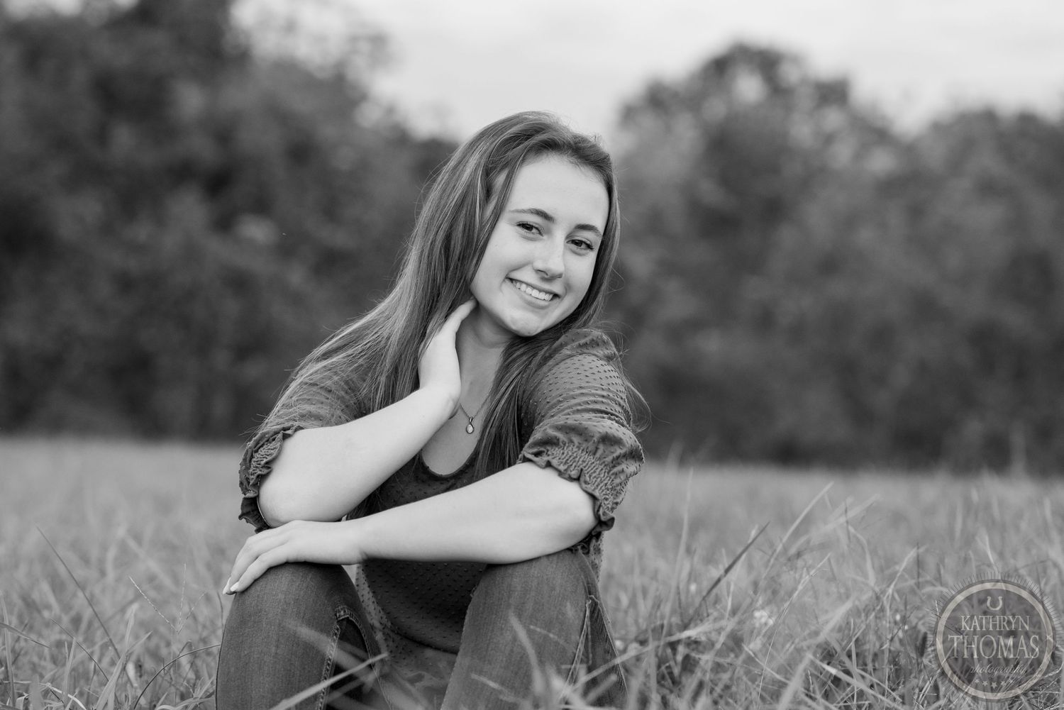 Black and white candid portrait showcasing genuine emotion in an outdoor setting.