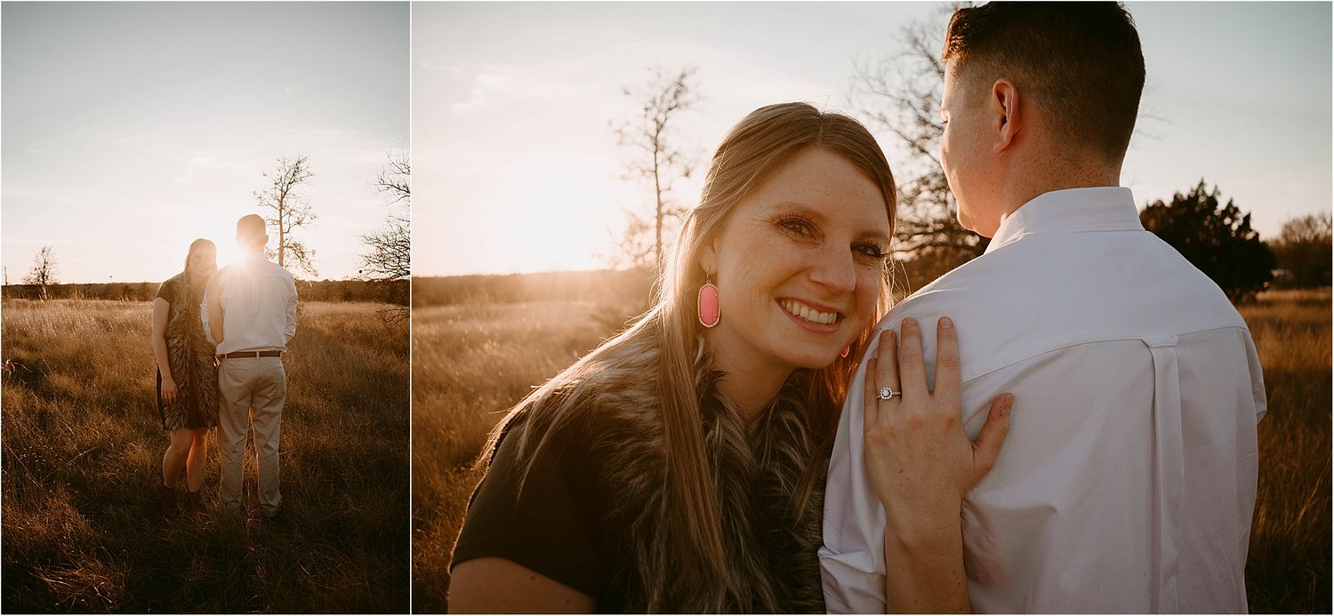 Couple embraces in golden sunlight during outdoor photo session.