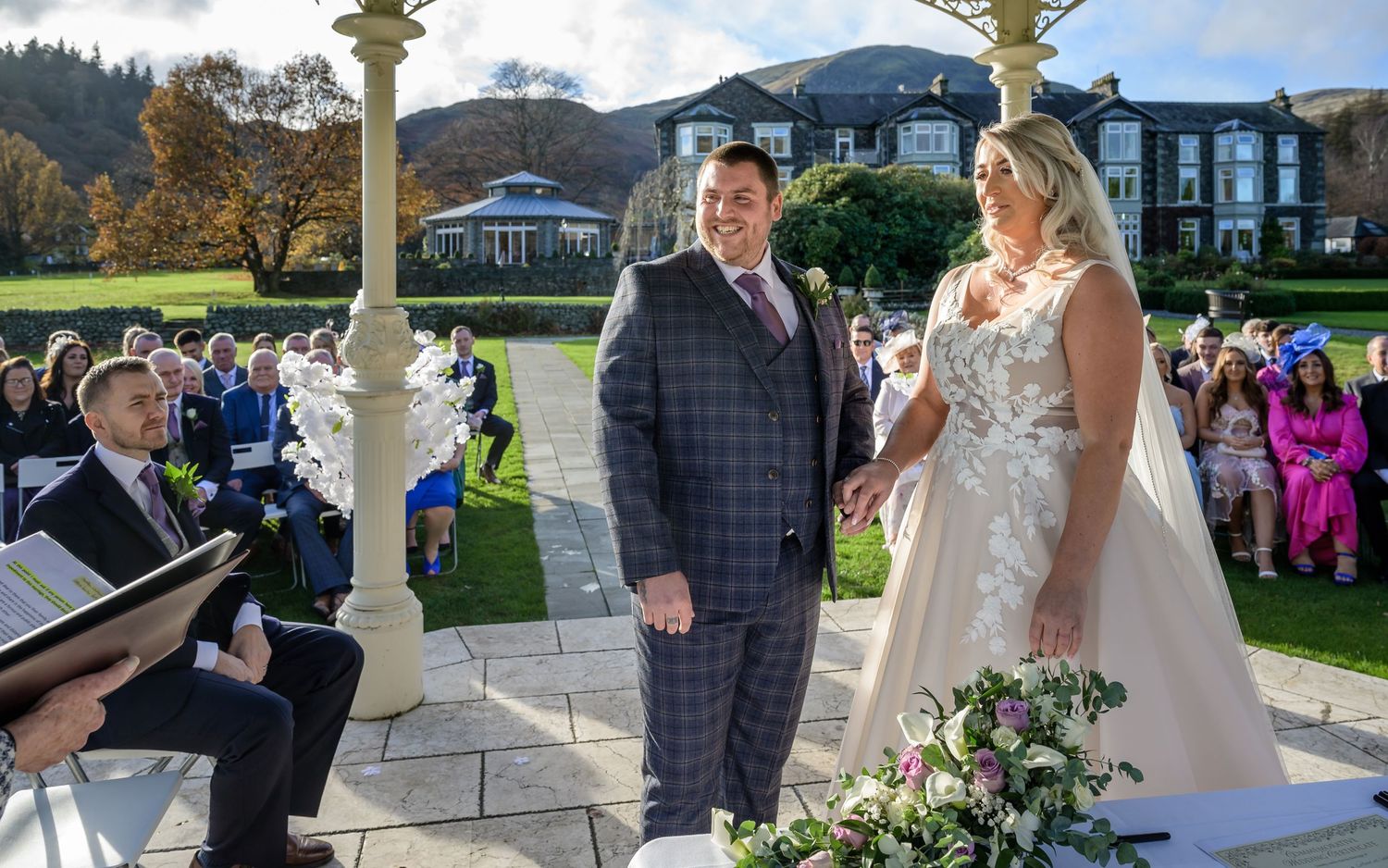 Bride and groom during outdoor ceremony at the Inn On The Lake