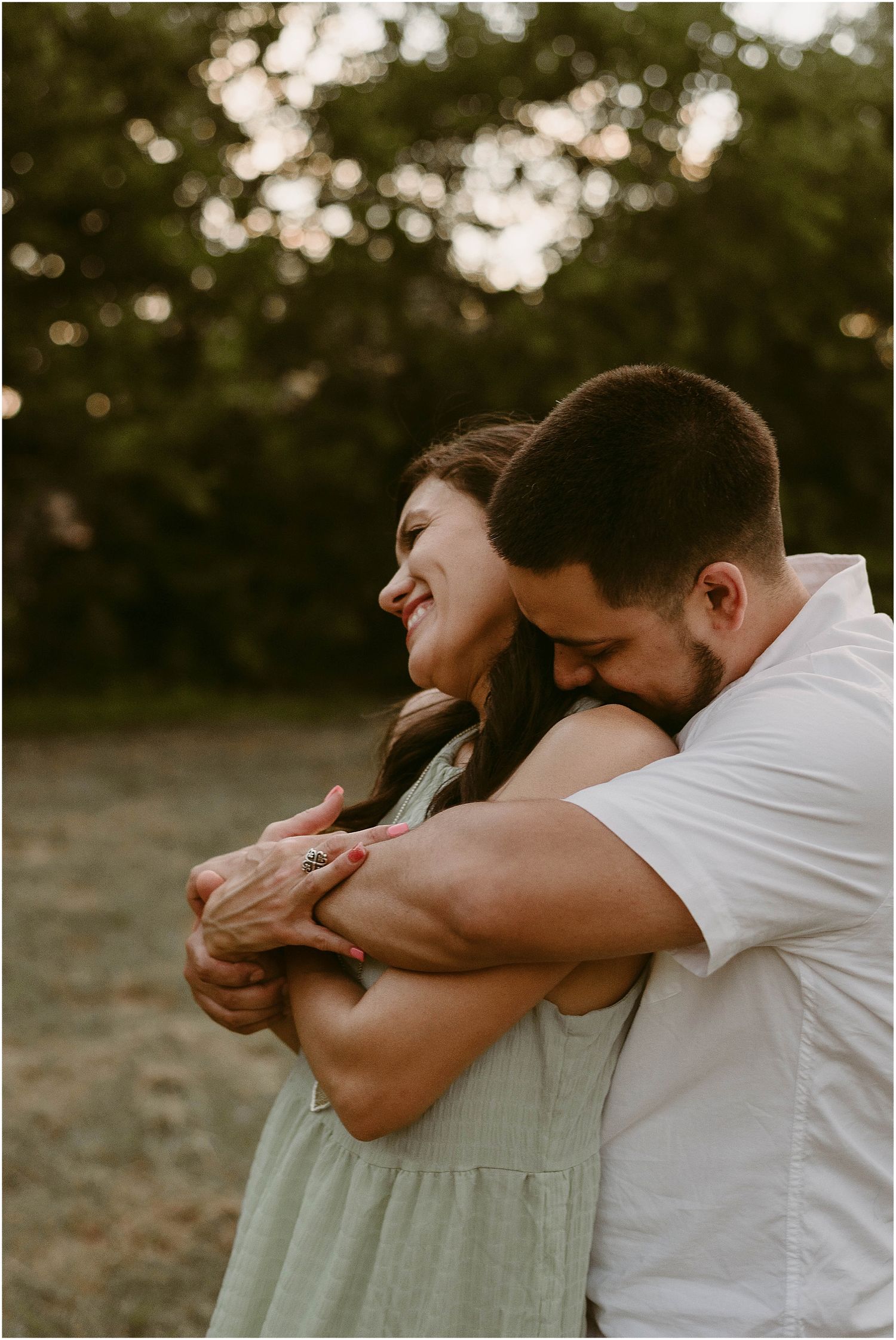 A joyful embrace captured in golden hour lighting showing genuine connection and love.