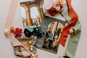 Details for October bride and groom. Rings, hair clips, invitations, loose flowers and ribbons.