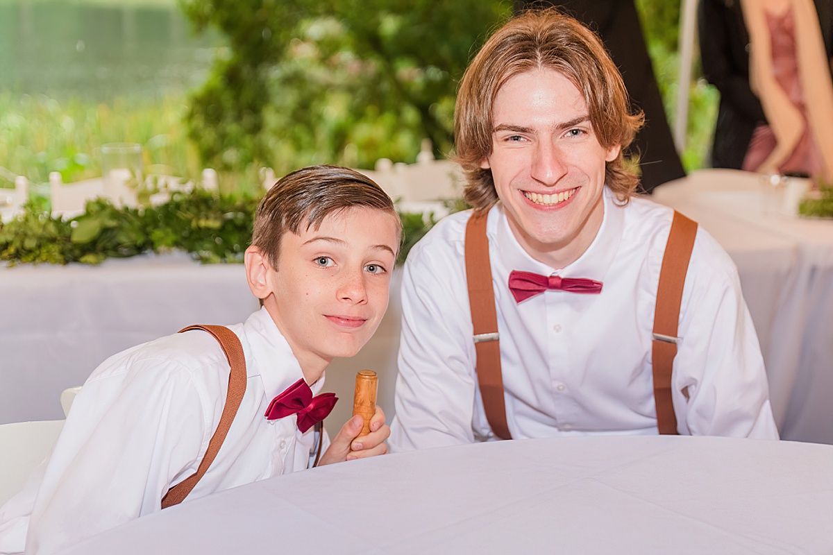 Brothers smiling at wedding reception by Indianapolis Indiana Wedding Photographer